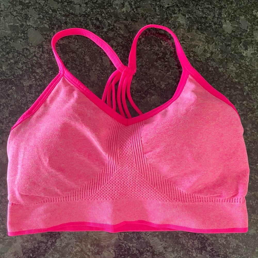Vibrant Pink Sports Bra. Comes with pads. NWOT